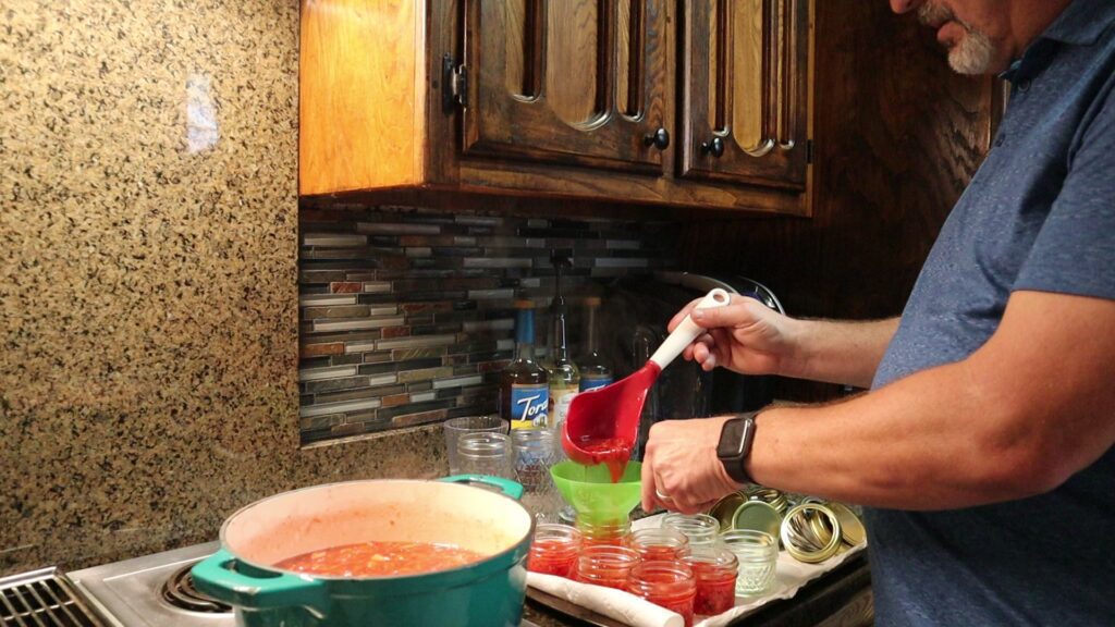 Filling the Jars with Strawberry Jalapeno Jam