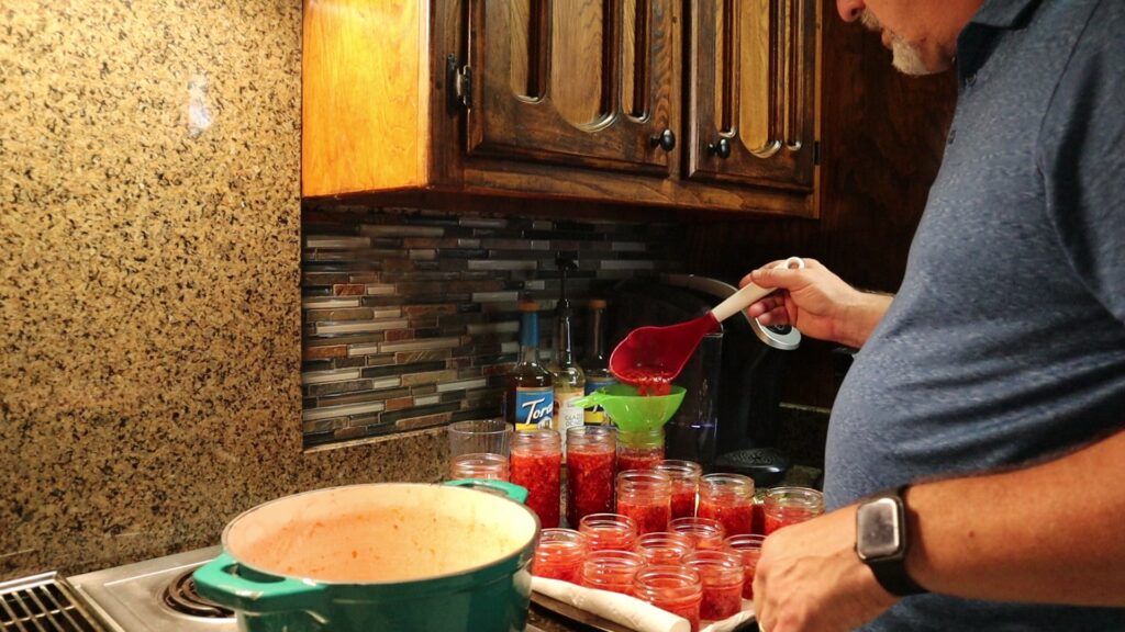 Filling the Jars with Strawberry Jalapeno Jam