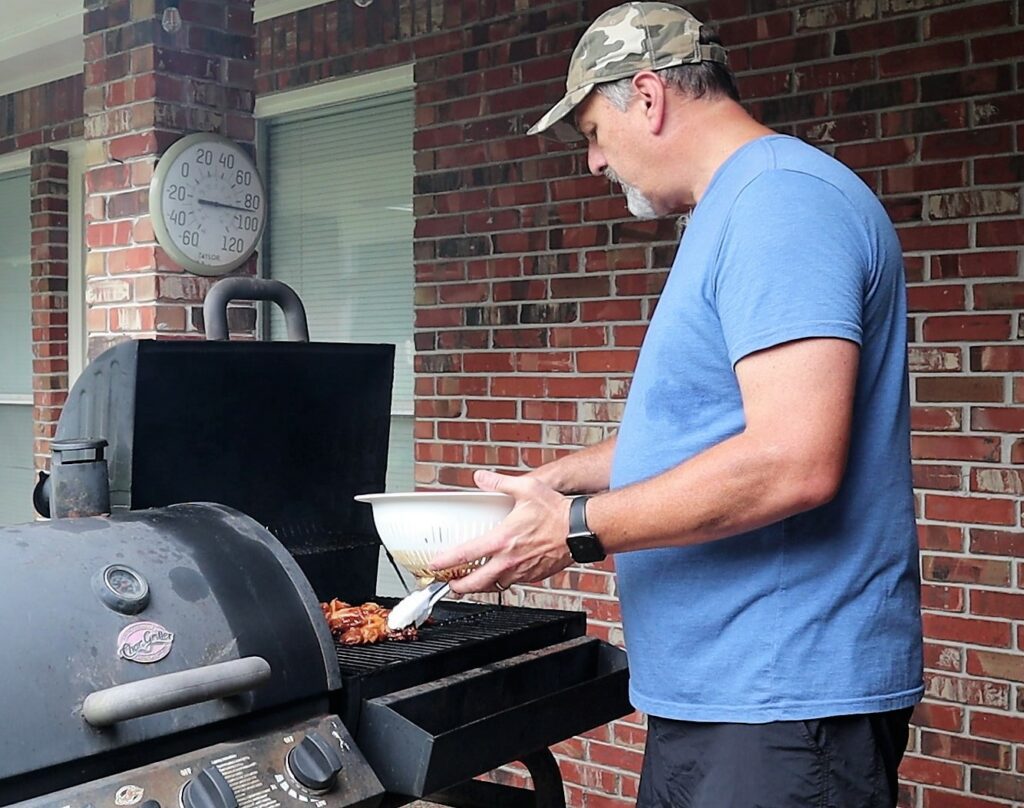 Placing Char Sui on the Grill