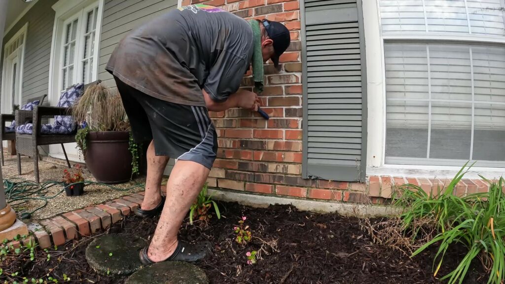 Running Tubing at the Front of the House to Water the Front Beds