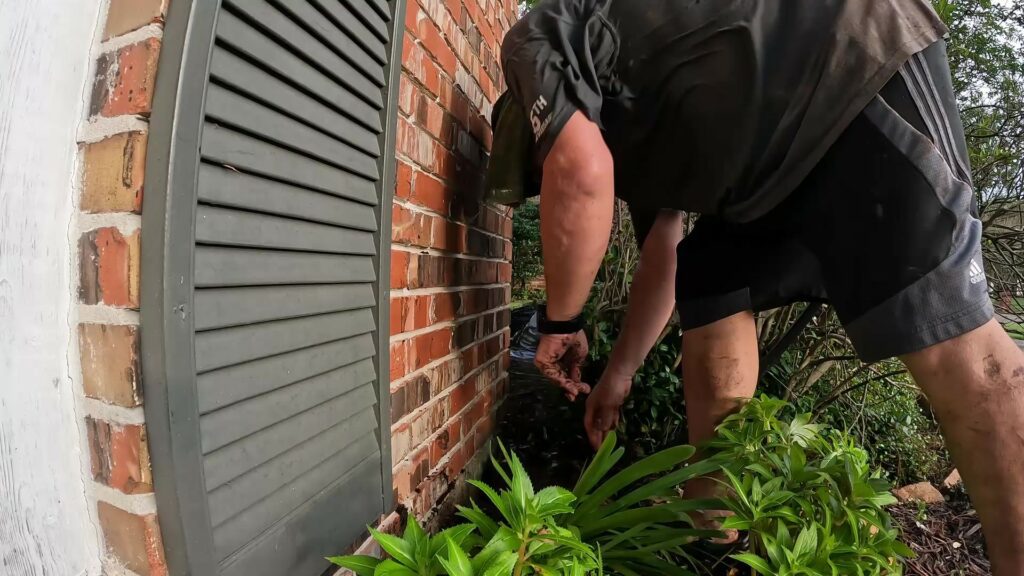 Running Tubing at the Front of the House to Water the Front Beds